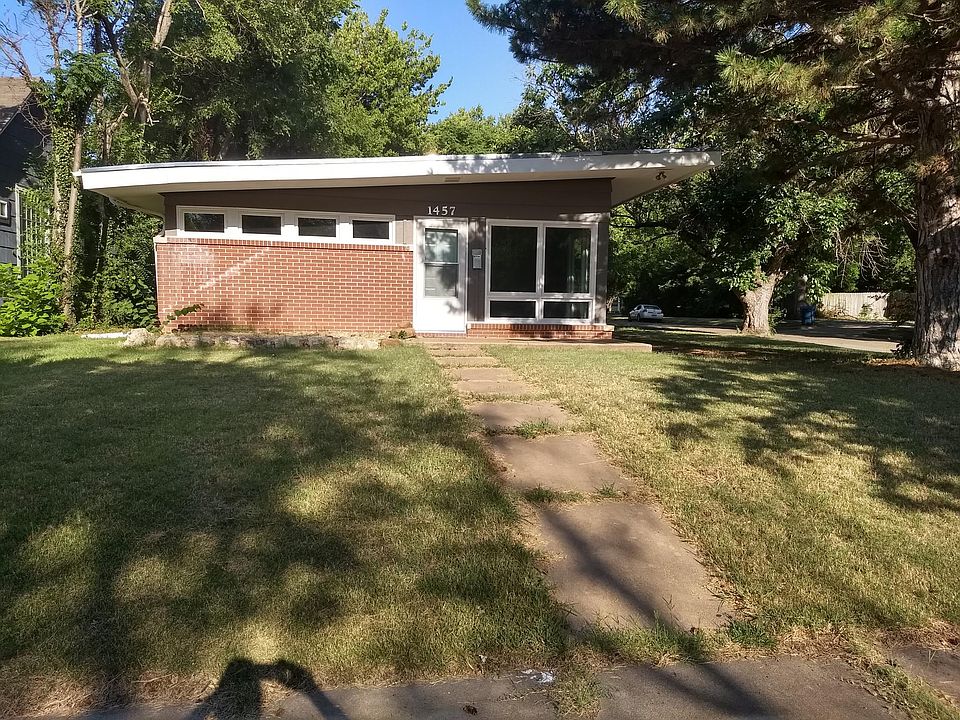 Entrance, with fresh paint and new windows.
