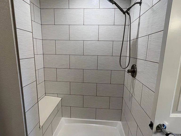 large shower with near new tile.