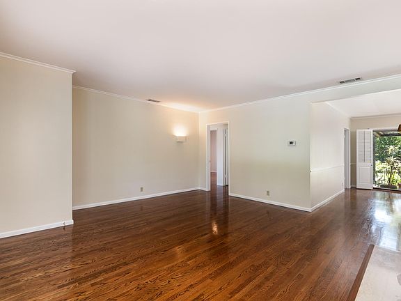 Living area, view to dining area and patio