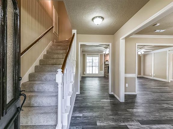 You will be impressed as you enter the home with the gorgeous wood-look tile flooring that flows throughout the main floor.