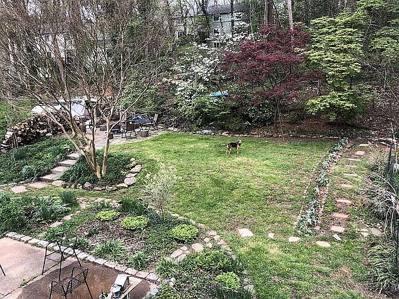 Shared backyard with patio and fire pit.