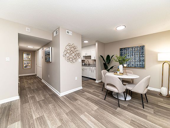 Dining area & entryway with hardwood-style flooring