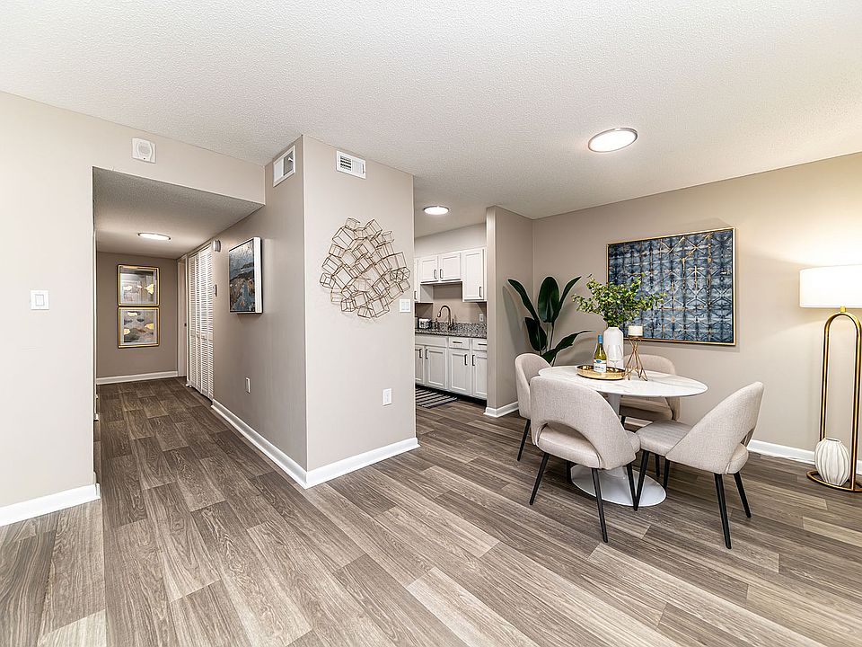 Dining area & entryway with hardwood-style flooring