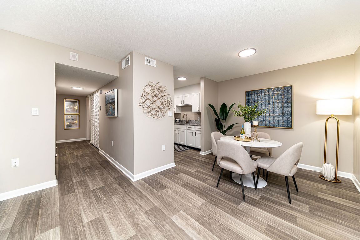 Dining area & entryway with hardwood-style flooring