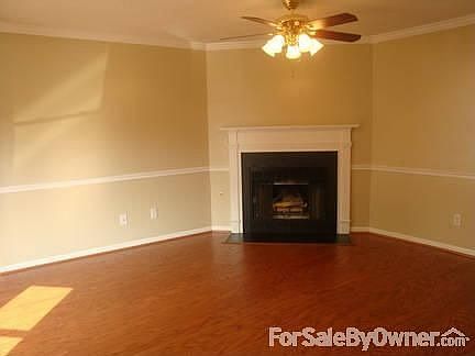LIVING ROOM : BRAND NEW OAK FLOORS, WOOD BURNING F/P WITH OPTION FOR GAS, CROWN & CHAIR RAIL