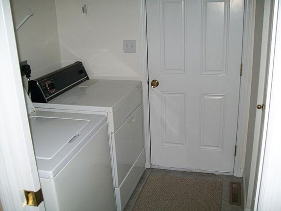 Laundry room and closet in entry through garage