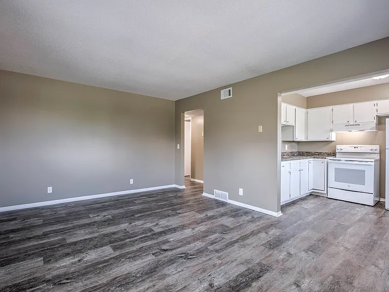 Large living room off of kitchen at Ashland Park Apartments.