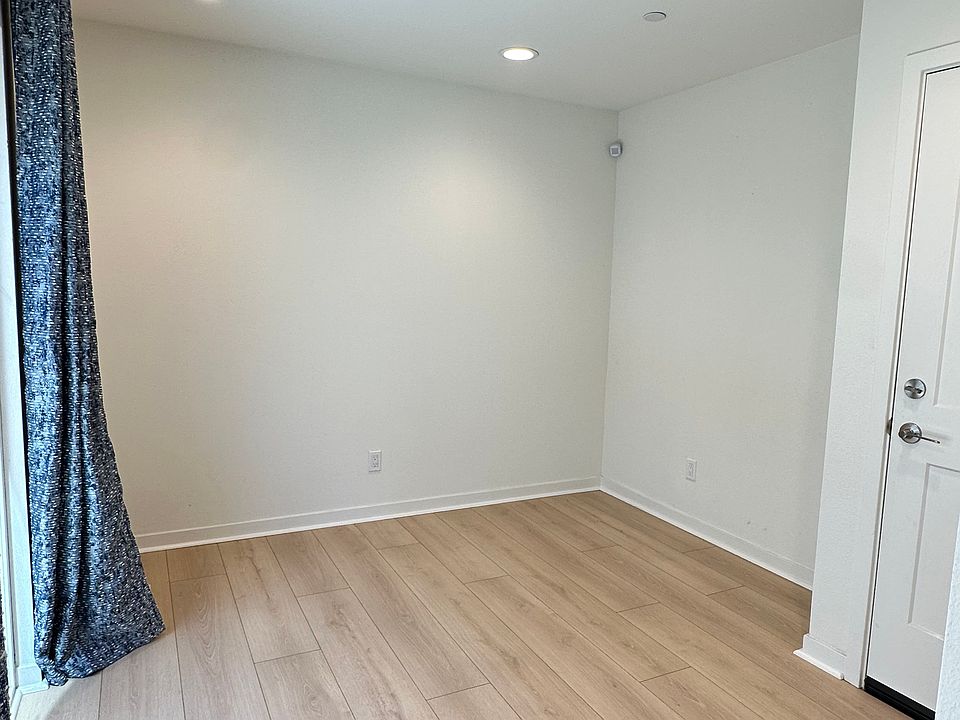 1st floor bonus room with sliding glass door and curtains