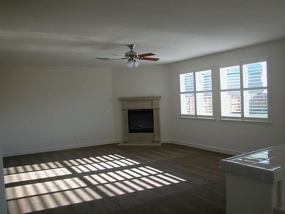 Family room with stone carved fireplace