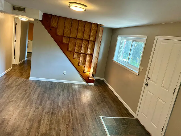 Staircase to upper level plus separate entrance to lower level (entrance is at foot of driveway, 2 steps down)