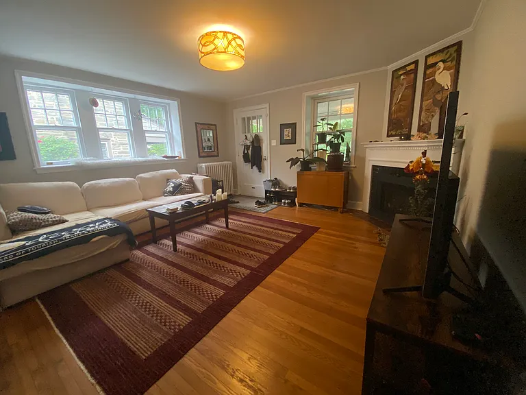 Living room with gas fireplace and bright windows
