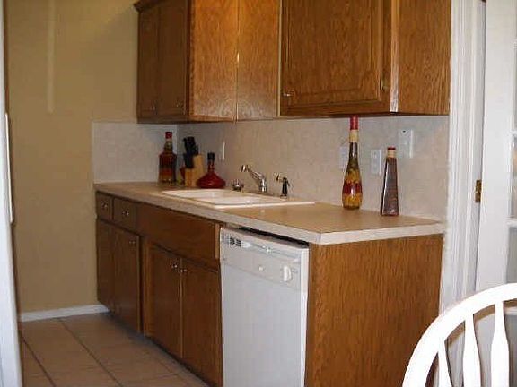 Galley Kitchen w/ White Appliances