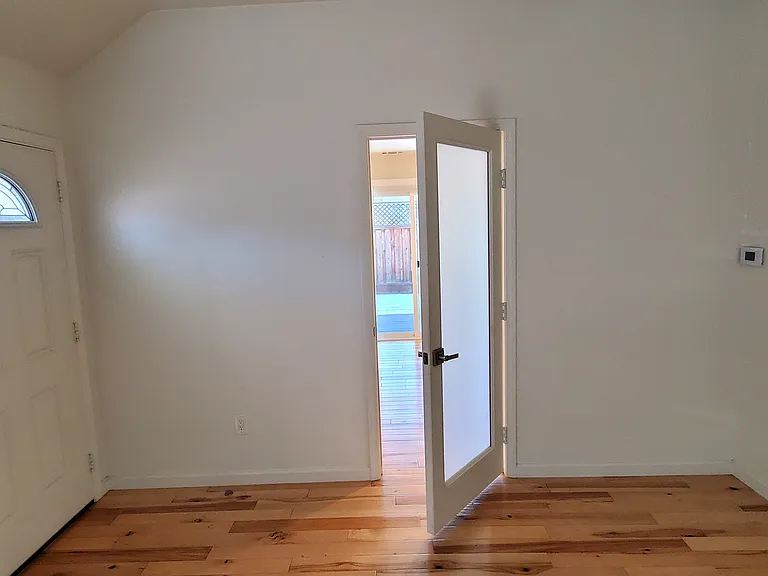 Main entry and door to the bedroom