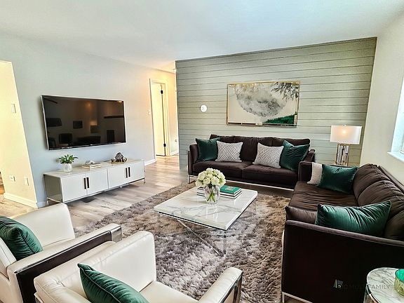 Experience comfort and style in this elegantly designed living room with cozy furnishings and contemporary touches.