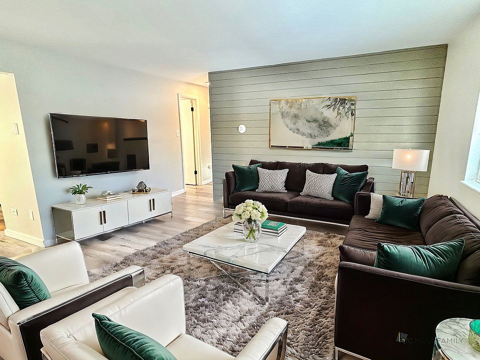Experience comfort and style in this elegantly designed living room with cozy furnishings and contemporary touches.