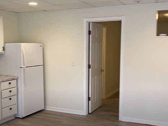 kitchen leading to bedroom and bathroom