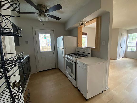 There is a two-sided kitchen and access to the side yard.