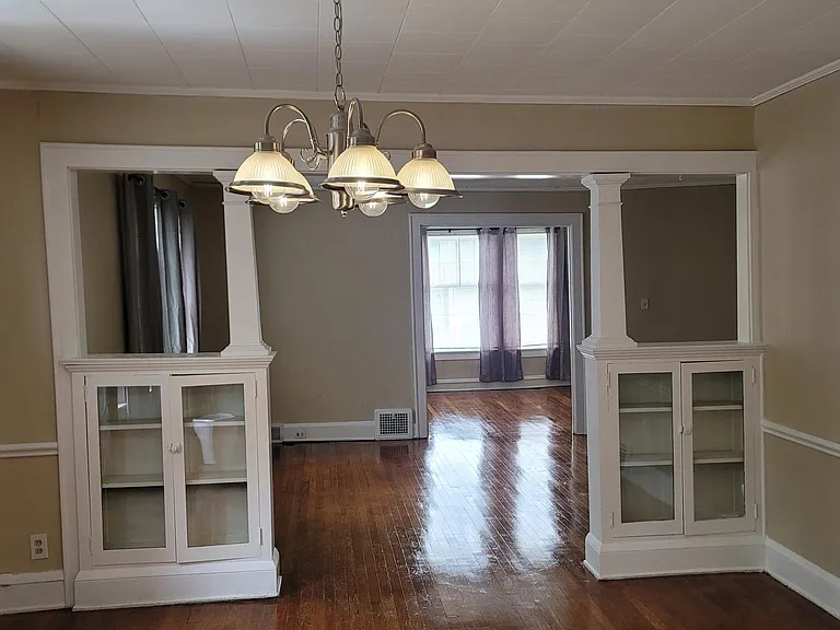 Dining room looking into family room looking into front sunroom parlor