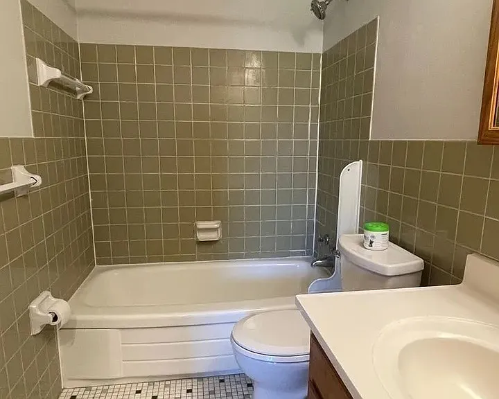 Step into comfort with this well-designed bathroom featuring classic tile accents and modern fixtures. Enjoy plenty of space and natural light, perfect for your daily routine. Schedule your visit today and see your new home at LS Capital Group!