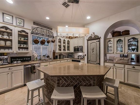 Gorgeous kitchen with cabinetry open to formal dining room.
