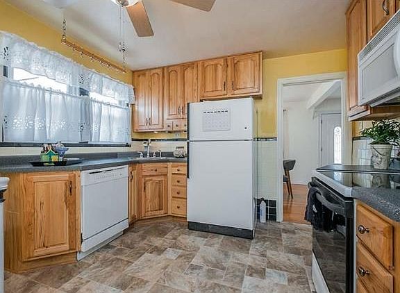 Brand new flooring plus 42 in cabs make for a very pretty kitchen.