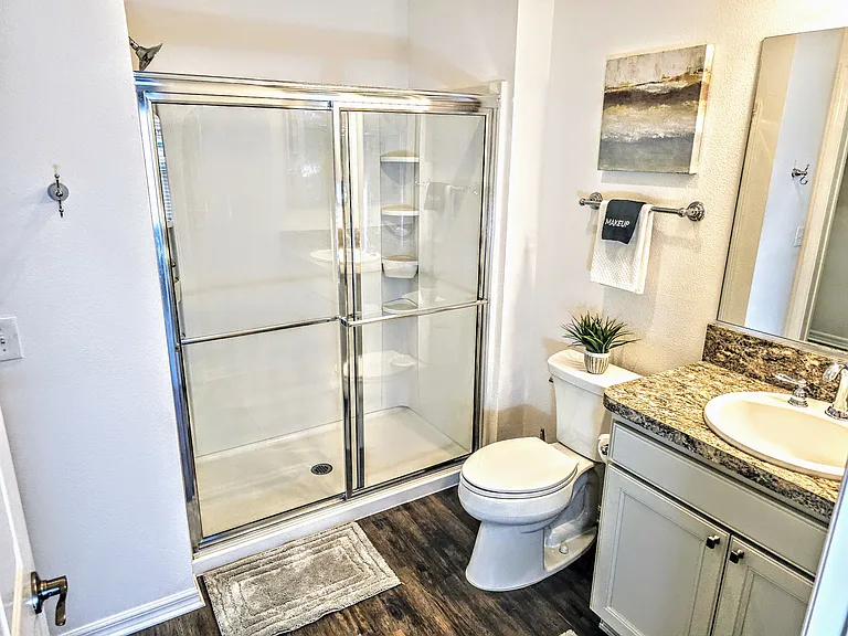 Walk-in shower off the master bedroom with walk in closet