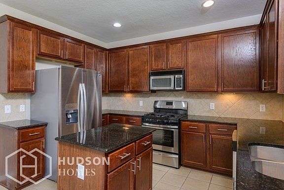 Hudson Homes Management - Kitchen featuring Stainless Steel Appliances