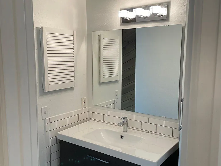 En-suite sink to master bedroom with storage