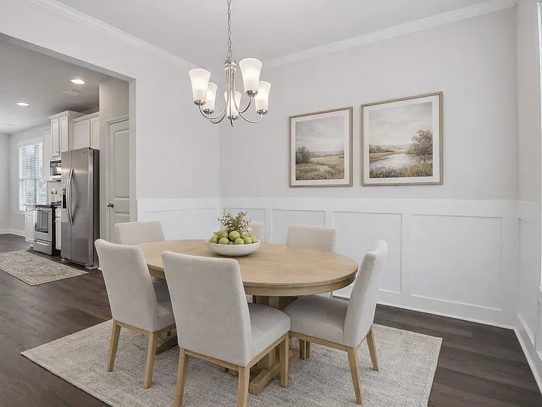 Elegant dining room featuring a rich wooden table and timeless seatingdesigned for unforgettable family gatherings.