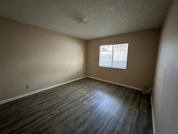 Large master bedroom. Walls are painted white now.