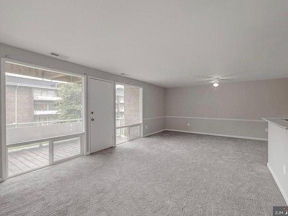 Wall-to-wall carpet. Stainless steel appliances, garbage disposal, dishwasher, gas stove, hood range.
