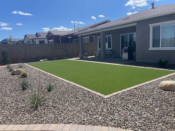 Backyard with Astroturf for Corn Hole Toss or ?