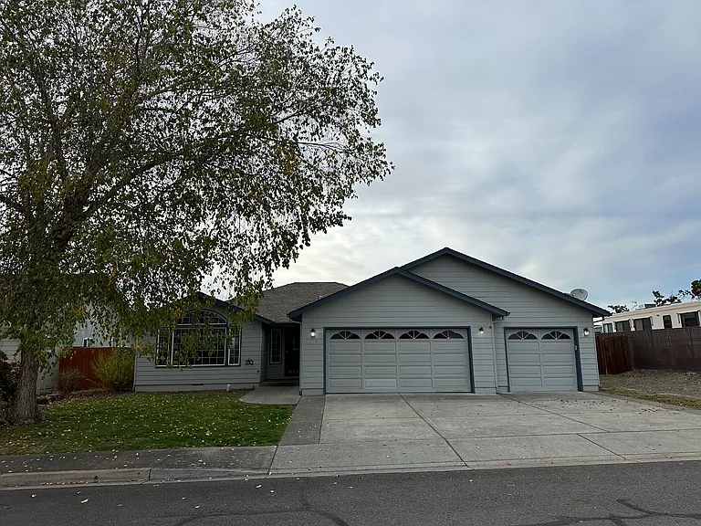 Front of home with 3 car garage and RV Parking!!