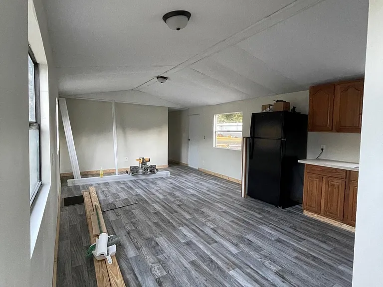 Plenty of living room space, new light fixtures and new flooring throughout.