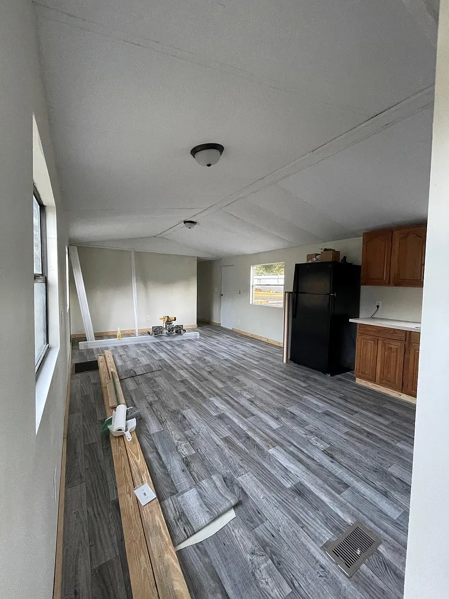 Plenty of living room space, new light fixtures and new flooring throughout. - 767 NW Amanda St #6