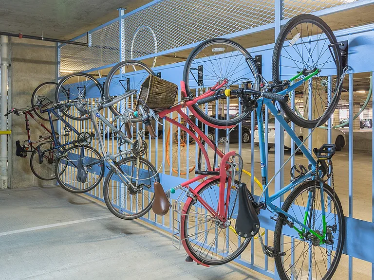 Efficient vertical bike racks offer generous space for bike storage.
