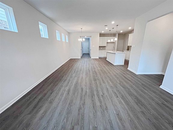 The Robin II-Family Room into Dining Area