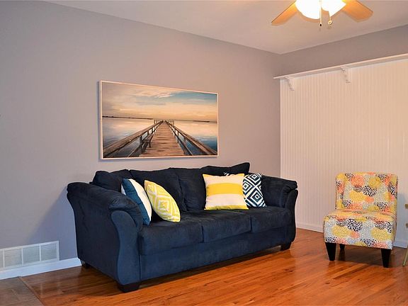 Another view of the Living Room with bead-boarded wall and accent shelving!
