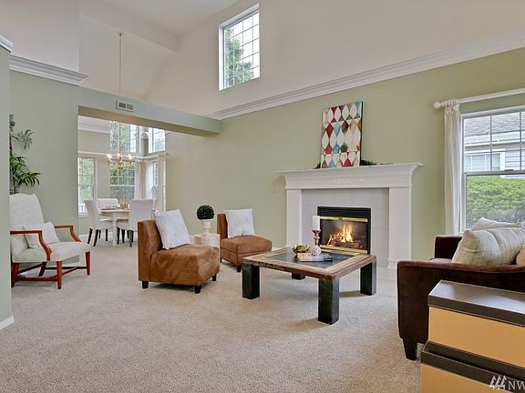 Lots of light in this comfortable living room flowing into the dining room