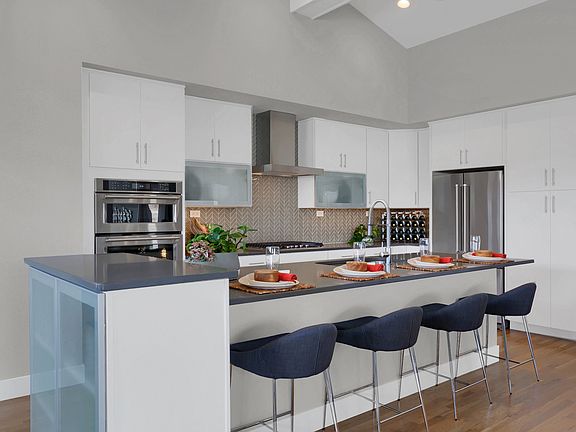 Expansive island in the kitchen allowing additional seating.