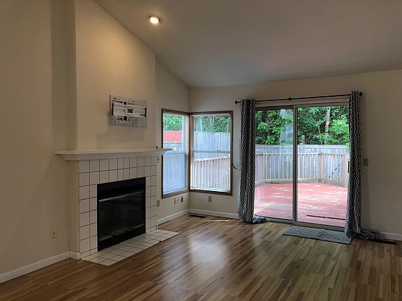 Living Room has Slider to Entertaining Deck and Fully Fenced