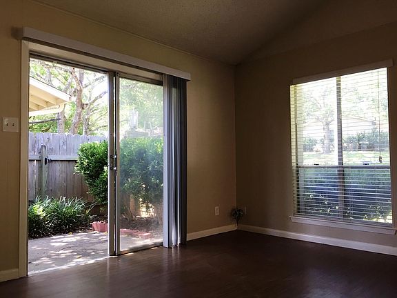 Double doors lead to small patio