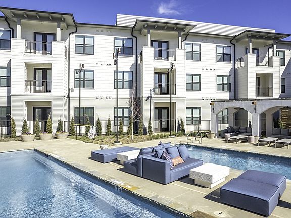 Dive into luxury at Modera Walsh with our unique swimming pool designs featuring island platforms for an elevated experience.
