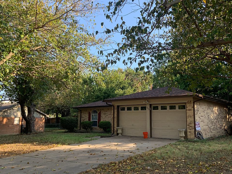 Front of house and right side yard.