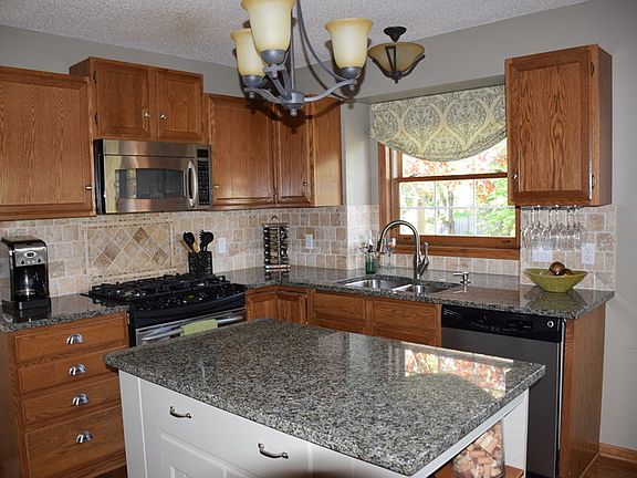 Large open kitchen w/center island, plenty of storage and updated appliances