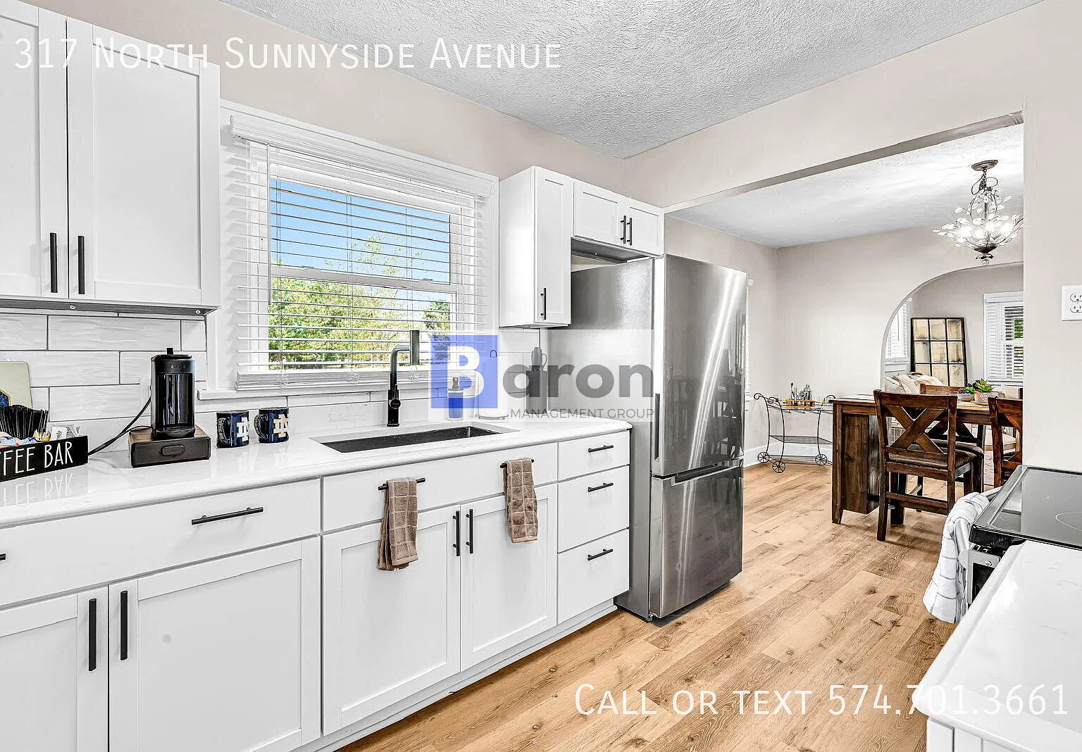 "Charming 4-Bedroom Home with Gleaming Hardwood Floors on North Sunnyside Avenue!" — Photo 2