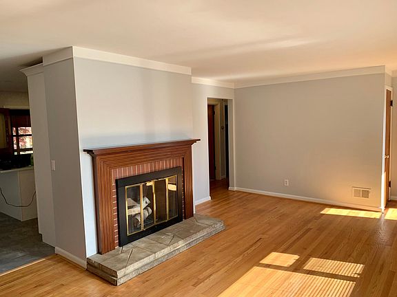 Family Room - decorative fireplace, kitchen & dining beyond