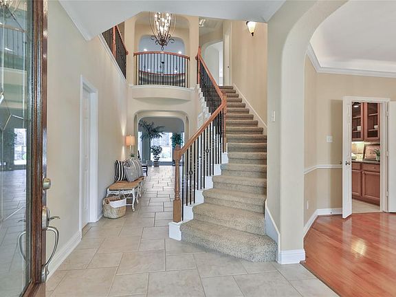 STRIKING TWO STORY ENTRY WITH TILE FLOORS