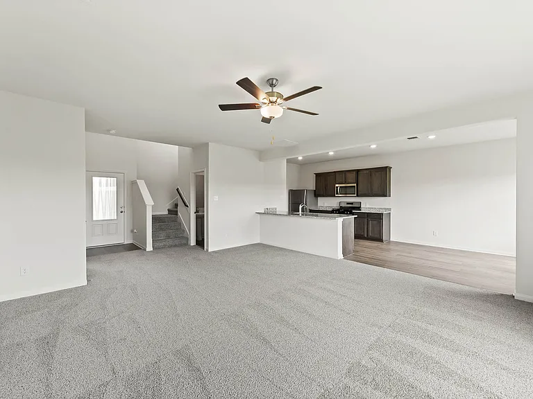 The open layout connects the kitchen with the dining room and family room.