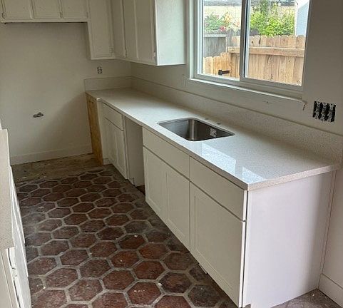 Windows over new kitchen countertops.